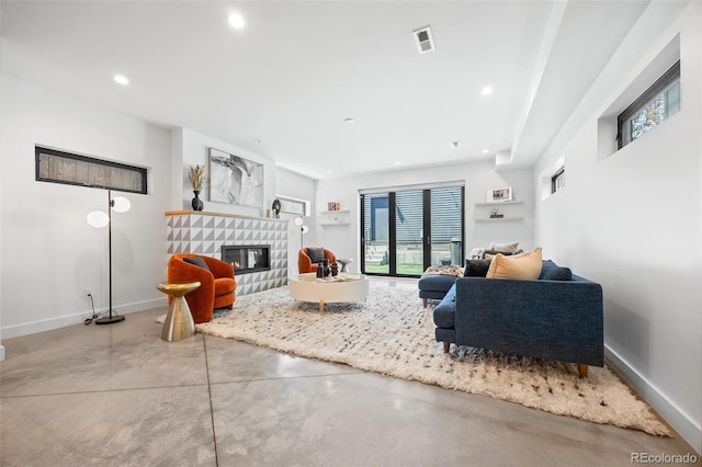 3409 Navajo St, Denver, CO 80211 - living area with concrete floors, a glass covered fireplace, baseboards, and recessed lighting