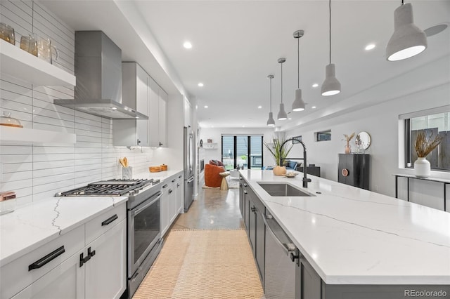 3409 Navajo St, Denver, CO 80211 - kitchen with stainless steel appliances, a sink, wall chimney exhaust hood, recessed lighting, and gray cabinetry