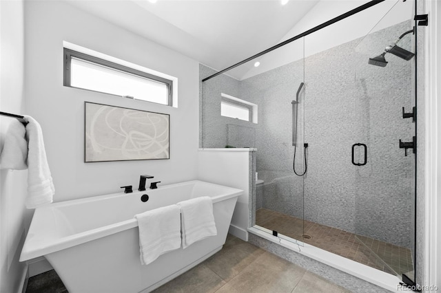 3409 Navajo St, Denver, CO 80211 - full bathroom with a shower stall, tile patterned floors, a freestanding tub, and lofted ceiling