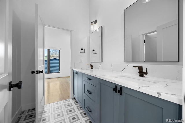 3409 Navajo St, Denver, CO 80211 - bathroom featuring double vanity and baseboards