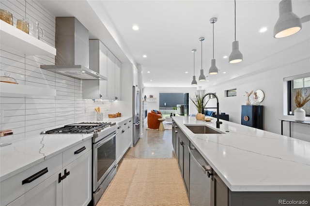 3409 Navajo St, Denver, CO 80211 - kitchen featuring a sink, appliances with stainless steel finishes, wall chimney exhaust hood, open floor plan, and recessed lighting