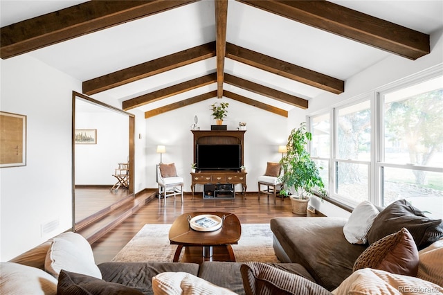 living room with vaulted ceiling with beams, baseboards, wood finished floors, and visible vents