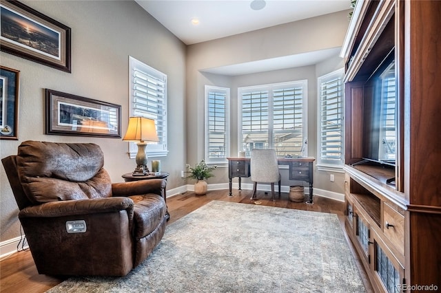 office area with baseboards, recessed lighting, plenty of natural light, and wood finished floors