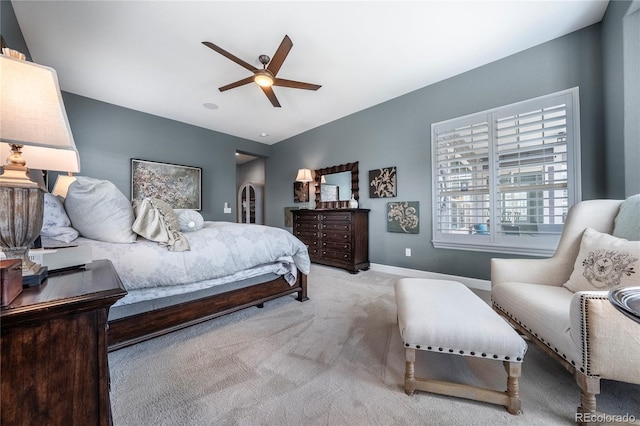 bedroom featuring baseboards, ceiling fan, and carpet