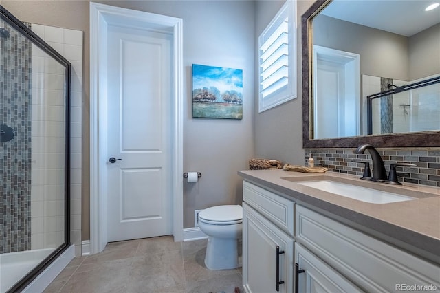 full bath with vanity, toilet, baseboards, tasteful backsplash, and a shower stall