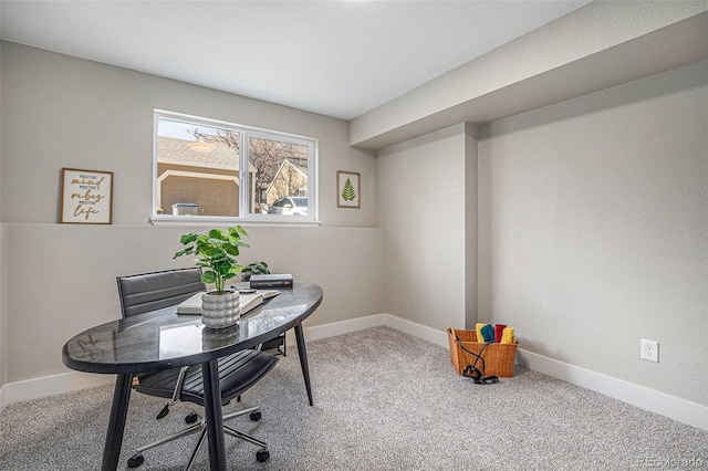 carpeted office with baseboards
