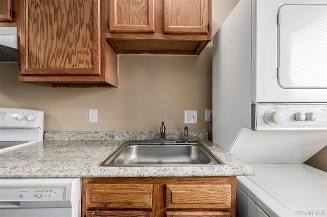 kitchen with sink, wall chimney range hood, and white dishwasher