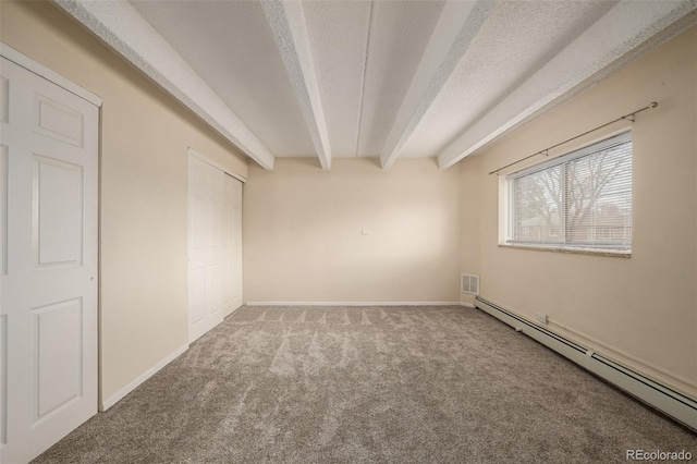 unfurnished bedroom with beamed ceiling, carpet, a baseboard heating unit, and a textured ceiling