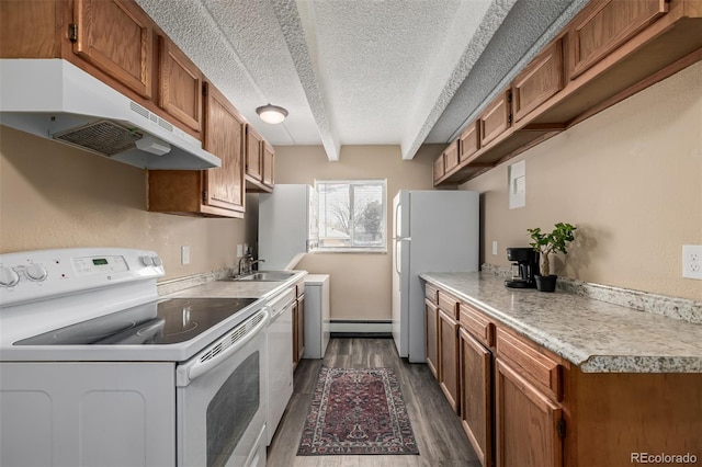 1180 Yosemite St Unit 104, Denver, CO 80220 - kitchen with under cabinet range hood, a baseboard heating unit, white appliances, a sink, and dark wood-style floors