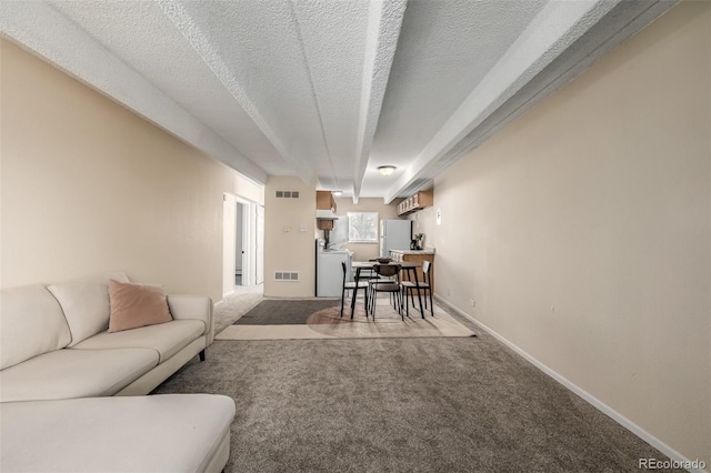1180 Yosemite St Unit 104, Denver, CO 80220 - living area featuring carpet flooring, a textured ceiling, and visible vents