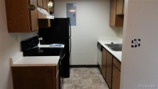 kitchen featuring black / electric stove and sink