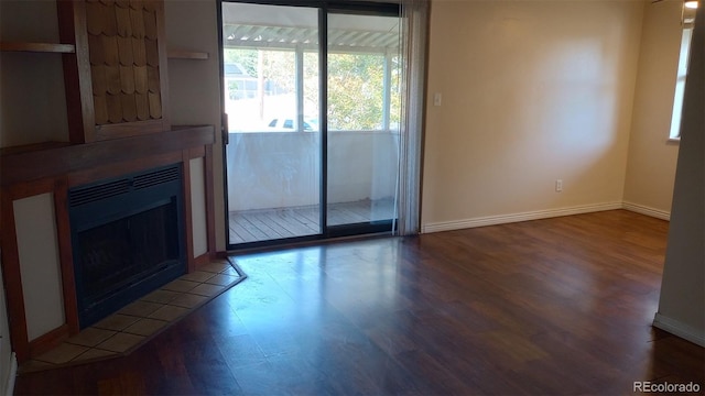 unfurnished living room with wood-type flooring