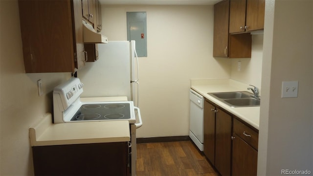 kitchen featuring dark hardwood / wood-style flooring, electric panel, sink, and white appliances