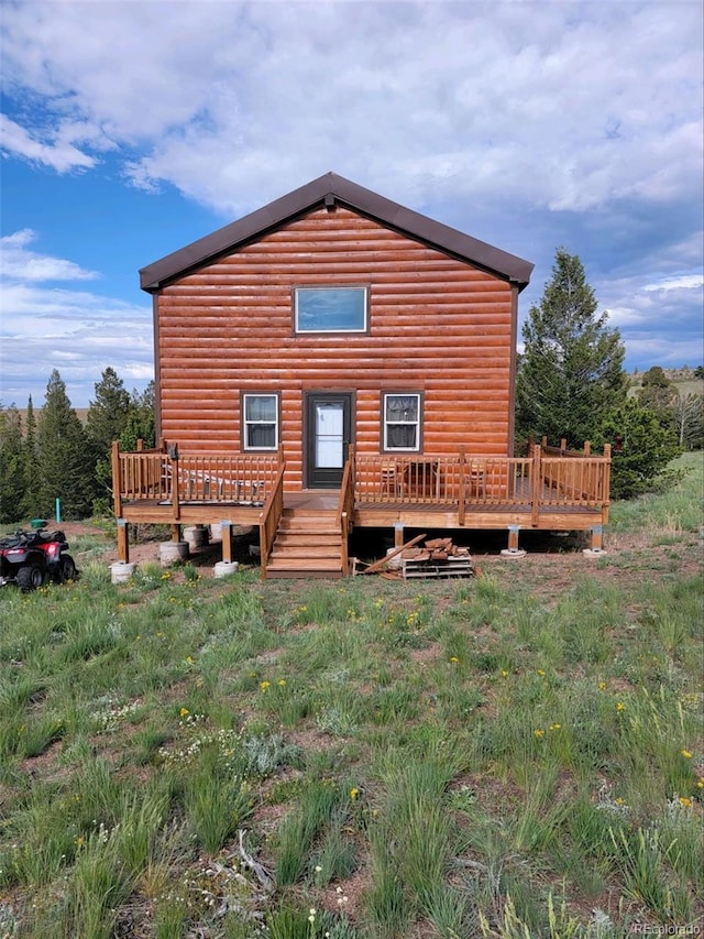 rear view of property with a deck