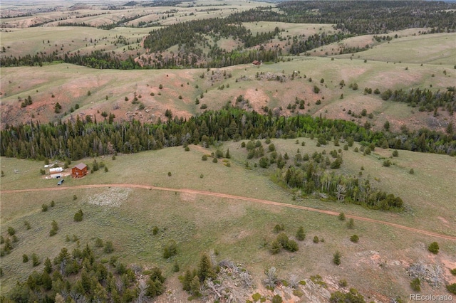 birds eye view of property with a rural view