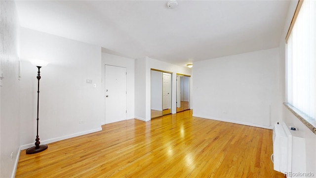 spare room featuring light wood-type flooring