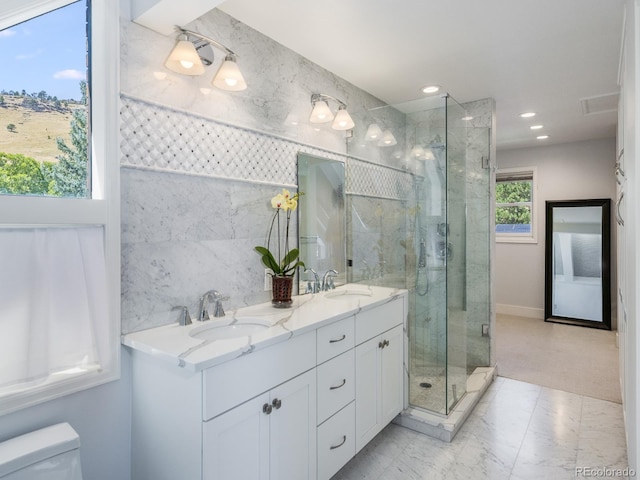 bathroom with vanity, toilet, and an enclosed shower