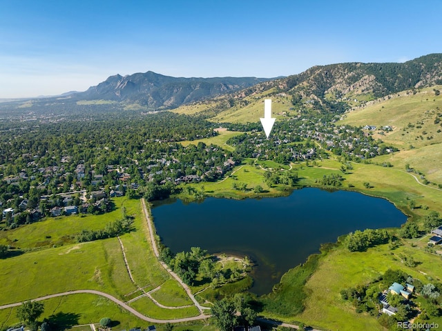 bird's eye view with a water and mountain view