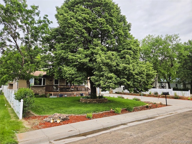 720 W 4th St, Julesburg, CO 80737 - view of property hidden behind natural elements featuring a deck