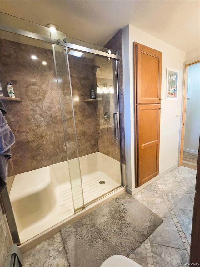 720 W 4th St, Julesburg, CO 80737 - full bath featuring a stall shower and baseboards