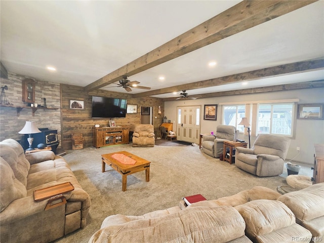 720 W 4th St, Julesburg, CO 80737 - carpeted living area featuring a wood stove, a ceiling fan, beamed ceiling, and recessed lighting