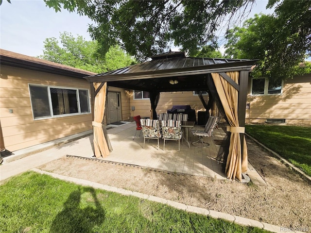 720 W 4th St, Julesburg, CO 80737 - back of house featuring a gazebo, a patio, a standing seam roof, and metal roof