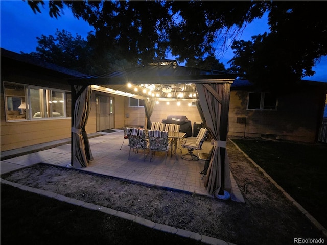 720 W 4th St, Julesburg, CO 80737 - patio at twilight with a patio area and a grill