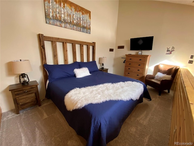 bedroom featuring carpet floors and a towering ceiling