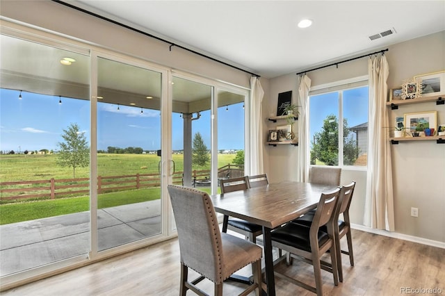 6513 Dry Fork Cir, Frederick, CO 80516 - dining space with light wood finished floors, recessed lighting, and a rural view