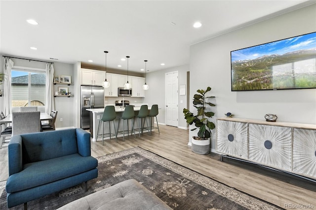 6513 Dry Fork Cir, Frederick, CO 80516 - living area featuring wood finished floors and recessed lighting