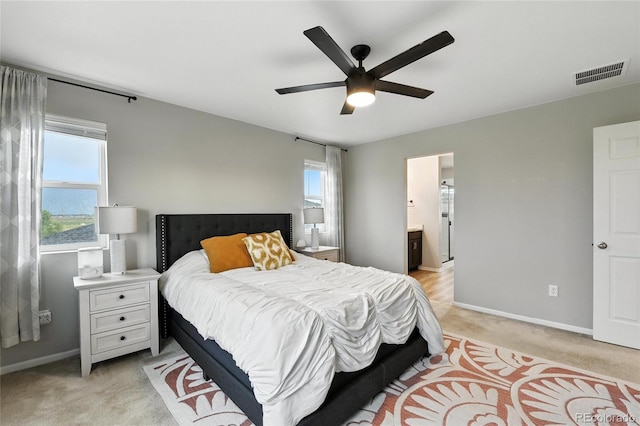 6513 Dry Fork Cir, Frederick, CO 80516 - bedroom featuring light carpet, multiple windows, and ceiling fan