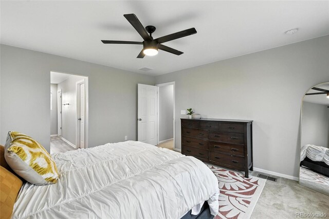 6513 Dry Fork Cir, Frederick, CO 80516 - bedroom with light carpet, arched walkways, and a ceiling fan