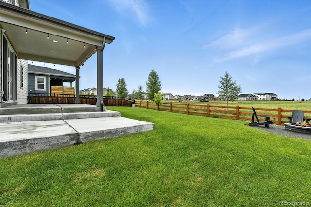 6513 Dry Fork Cir, Frederick, CO 80516 - fenced backyard featuring a patio and an outdoor fire pit