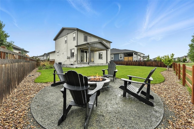 6513 Dry Fork Cir, Frederick, CO 80516 - back of property with an outdoor fire pit and a fenced backyard