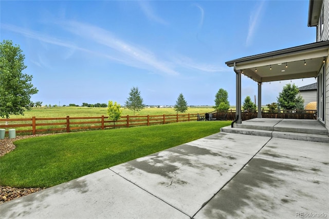 6513 Dry Fork Cir, Frederick, CO 80516 - fenced backyard featuring a patio area and a rural view