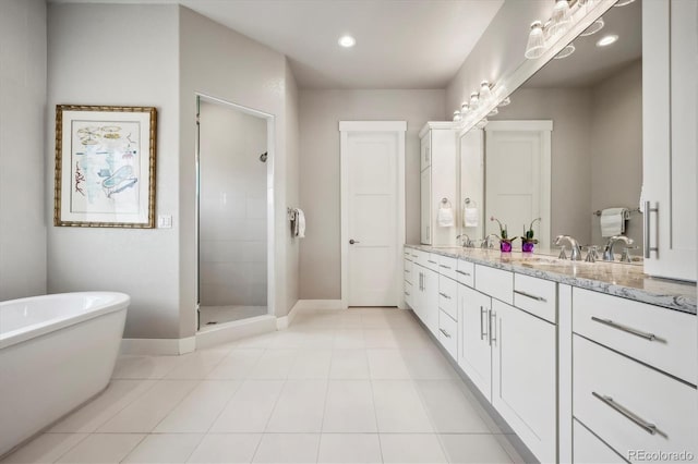 bathroom with shower with separate bathtub, tile patterned floors, and vanity