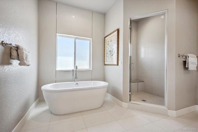 bathroom with tile patterned flooring and independent shower and bath