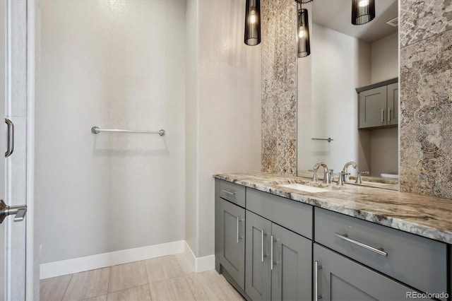 bathroom featuring walk in shower, vanity, and tile patterned flooring