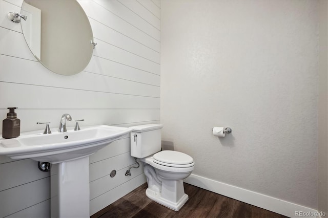 bathroom featuring hardwood / wood-style floors and toilet