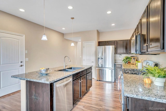 861 Circle Rd, Palmer Lake, CO 80133 - kitchen with a sink, light wood-style flooring, appliances with stainless steel finishes, and dark brown cabinets