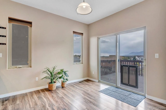 861 Circle Rd, Palmer Lake, CO 80133 - entryway with baseboards and wood finished floors