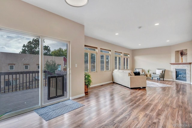 861 Circle Rd, Palmer Lake, CO 80133 - living area featuring recessed lighting, baseboards, wood finished floors, and a fireplace