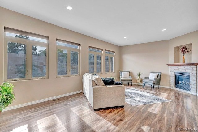 861 Circle Rd, Palmer Lake, CO 80133 - living area with baseboards, wood finished floors, visible vents, and a fireplace