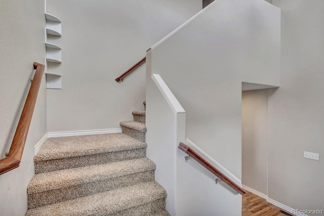 861 Circle Rd, Palmer Lake, CO 80133 - stairs featuring baseboards and wood finished floors