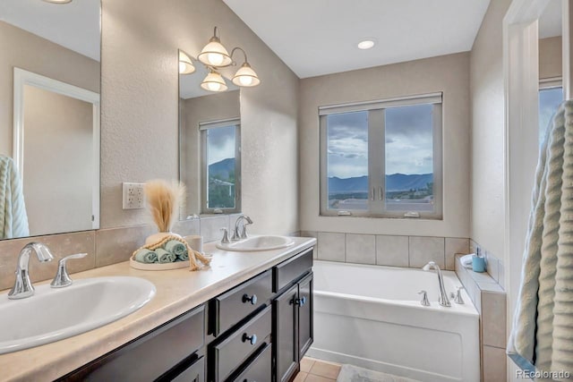 861 Circle Rd, Palmer Lake, CO 80133 - full bath with double vanity, tile patterned flooring, a sink, and a garden tub