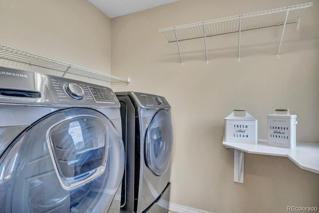 861 Circle Rd, Palmer Lake, CO 80133 - washroom featuring separate washer and dryer, laundry area, and baseboards