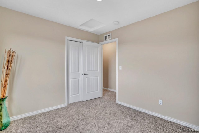 861 Circle Rd, Palmer Lake, CO 80133 - unfurnished bedroom featuring carpet floors, baseboards, visible vents, and a closet