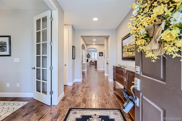 foyer with dark wood-type flooring