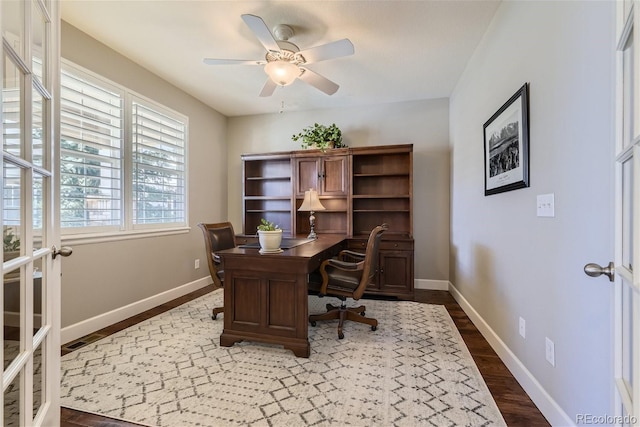 office space with ceiling fan and dark hardwood / wood-style floors