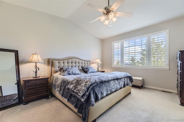 carpeted bedroom featuring vaulted ceiling and ceiling fan